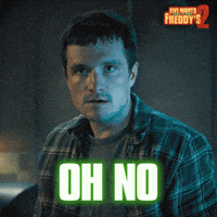 Sponsored gif. Josh Hutcherson as Mike Schmidt in Five Nights at Freddy's 2 looks nervously offscreen in a dark room with blue lighting. The Five Nights at Freddy's 2 logo is in the upper right corner. Text reads: "Oh no"  