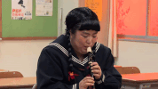 flute playing comedy GIF