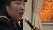 flute playing comedy GIF