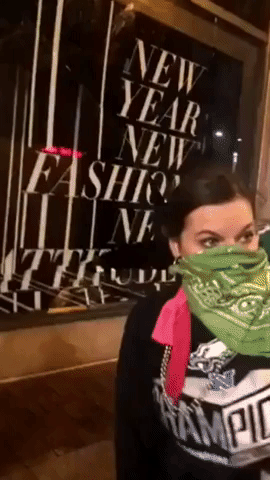 Masked Man Smashes Store Window Amid Philadelphia Celebration