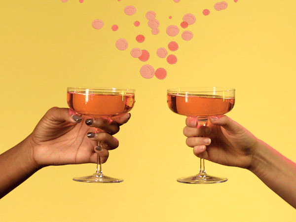 Ad gif. Two hands clink coupe glasses full of Chandon together, and an animated spark appears along with a trail of bubbles.