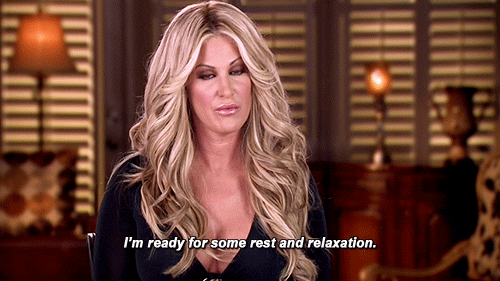 Reality TV gif. Kim Zolciak-Biermann on Don't Be Tardy tilts her head as she says, "I'm ready for some rest and relaxation."