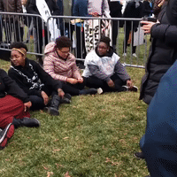Black Lives Matter Protesters Chain Themselves to Inauguration Checkpoint Barrier