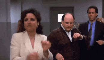 Seinfeld gif. Julia Louis Dreyfus as Elaine, Jason Alexander as George, and Jerry Seinfeld happily dance toward us, synchronistically.