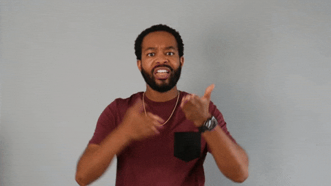 Celebrity gif. Tristen Winger points forward at us with both arms with a facial expression of frustrated but grateful validation as he says, "thank you."