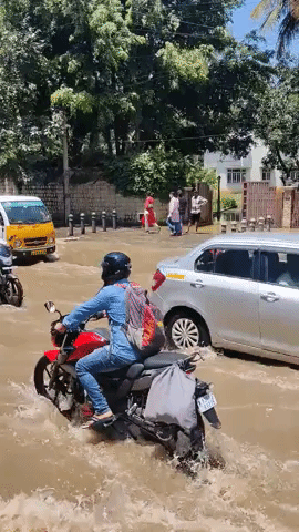 Commuters Drive Through Flooded Roads in Bangalore, India