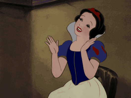 Movie gif. Snow White smiles gleefully as she happily claps her hands.