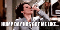 Celebrity gif. Resolute Megan Mullally chugs a bottle of water above the caption, “Hump day has got me like…”