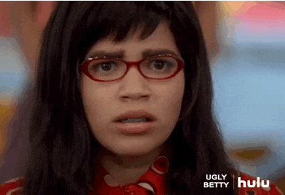TV gif. America Ferrera as Betty on Ugly Betty. She looks very nervous as she swallows her spit and adjusts her neck collar, staring at something unblinkingly.