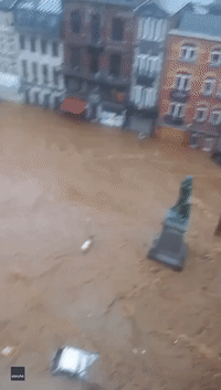 Submerged Vehicles Line Streets in Eastern Belgium Amid Heavy Rains