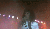 performing freddie mercury GIF