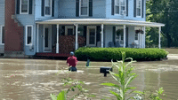 People Wade Through Thigh-High Water in Flood-Hit Areas of Vermont