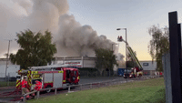 Firefighters Tackle Industrial Blaze in Greater Manchester