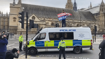 Insulate Britain Protester Climbs Onto Police Van in Westminster