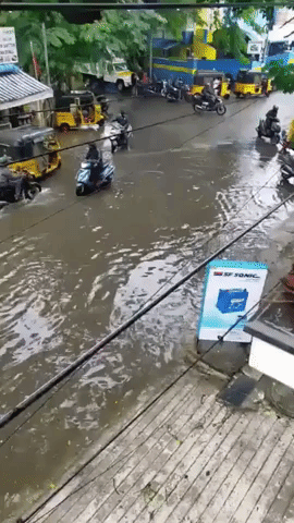 Motorists Drive on Flooded Street in Monsoon-Hit Chennai