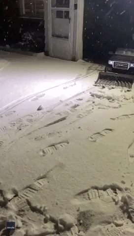 Little Boy Helps Dad Plow Snow in Toy Car as Snowstorm Hits Michigan