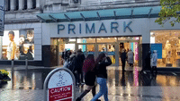 Shoppers Wait in Line in Liverpool as Coronavirus Lockdown Eases Across England