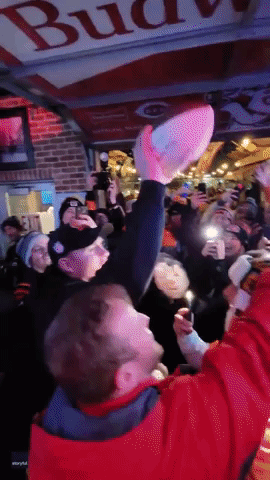 Bengals Coach Zac Taylor Brings Game Ball to Bar