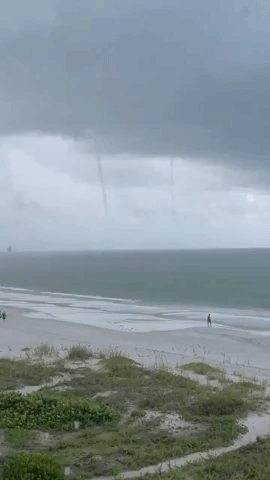 Twin Waterspouts Whirl in Sky Near Florida Beach