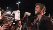 happy liam hemsworth GIF