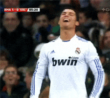 Sports gif. Cristiano Ronaldo stands in front of a crowd holding his hands on his hips as he throws his head back with a laugh.