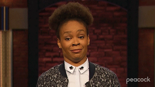 TV gif. Amber Ruffin shrugs as she tilts her head to her shoulder and rolls her eyes with a taut smile on the set of her eponymous show.
