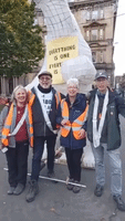 'Clarion the Bear' and Climate Activists Complete 306-Mile Walk to Glasgow