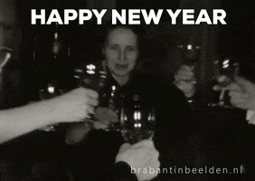 Video gif. A group of women in a black and white gif lean in to toast with their champagne glasses to ring in the new year, animated fireworks bursting over their clinking glasses. Text, "Happy new year."