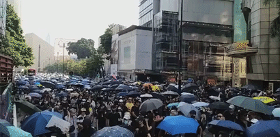Clashes Between Protesters and Police in Kowloon Follow Masked March