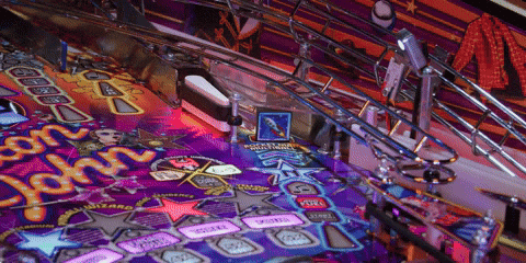 Pinball machine manufacturer working on a game