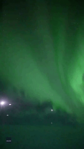 Plane Passenger Captures Stunning Green Aurora Over Antarctica