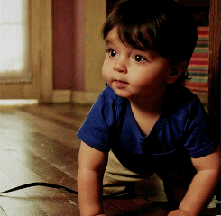 TV gif. Aiden Fernandes as Mateo in Jane the Virgin crawls on the floor.