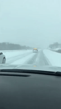 Police Guide Drivers Through Snow-Covered Roads in Minnesota