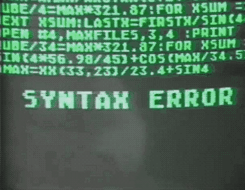 Video gif. Neon green code text on computer screen precedes a blinking phrase, "Syntax error," which is then followed by a scene of a woman swinging a sledgehammer at a computer, causing it to explode.