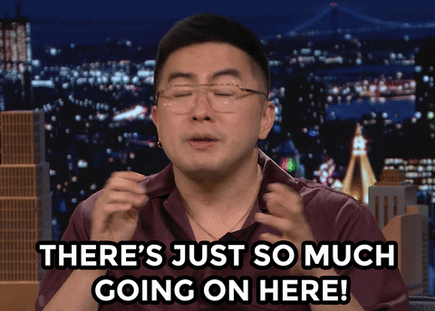 A man is saying the words "THERE'S JUST SO MUCH GOING ON HERE!"