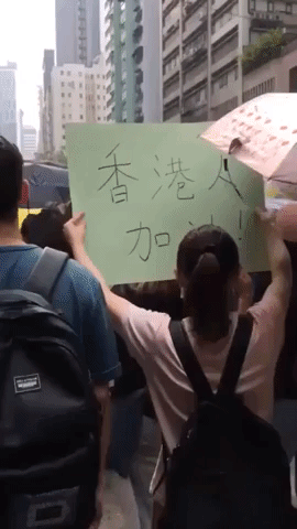 Protesters March on Posters of China's President Xi on Hong Kong Streets