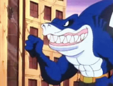 Cartoon gif. Blue shark character, Ripster, from Street Sharks gives a thumbs up and displays all his teeth as he speaks. Text, "Nice."