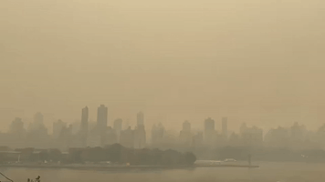 Dense Wildfire Smoke Envelopes Manhattan Cityscape