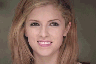 Celebrity gif. Anna Kendrick smiles exuberantly, then squints as she turns her head slightly.