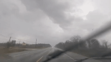 Vehicles Drive Through Streams of Heavy Rain in Southeastern Texas
