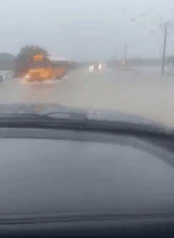 School Bus Navigates Flooded Roads in Mesquite