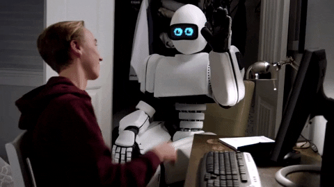 News MEI - Edição 19 - GIF de garoto batendo, com a palma da própria mão, com a mão de um robô.