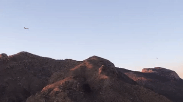 Tanker Aircraft Navigates Arizona Mountains to Drop Flame Retardant