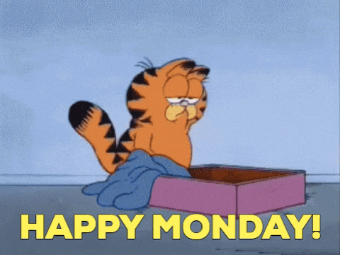 Cartoon gif. Garfield walks towards and drops face first into a box lined with a blanket. His black striped tail points to the sky. Text, "Happy Monday!"