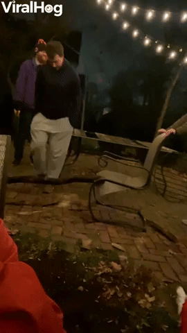 Man Falls Flat on His Face After Jumping on Log