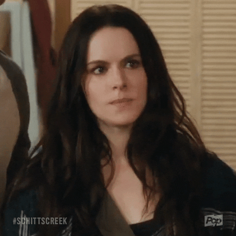 Schitt’s Creek gif. Emily Hampshire as Stevie shakes her head in disagreement and says, “nope.”