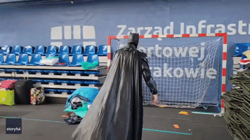 'Batman' Becomes Goalkeeper for Soccer Game at Polish Refugee Shelter