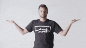 Video gif. A bearded man in a "Dash Home Loans" t-shirt holds out his arms and tilts like a scale, eventually leaning to one side.
