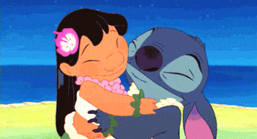 Disney gif. Lilo and Stitch close their eyes as they pull each other in for a hug, smushing their cheeks together.