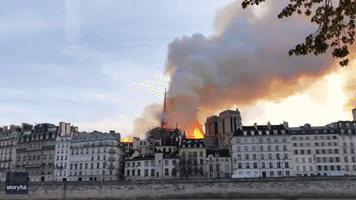 Spire Falls as Flames Engulf Notre Dame Cathedral in Paris